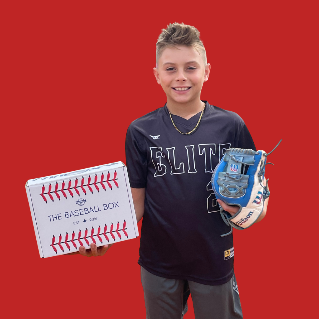 Young baseball player holding The Baseball Box and a Wilson glove